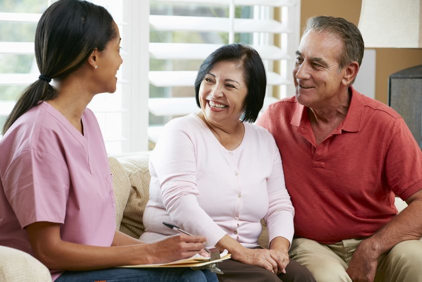 18735811 - nurse making notes during home visit with senior couple